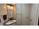 Clean bathroom with corner sink, vanity, and linen storage at 17200 W Bell Rd # 569, Surprise, AZ 85374