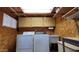 Practical laundry room with washer, dryer, and overhead cabinets at 17200 W Bell Rd # 569, Surprise, AZ 85374