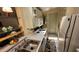 Galley style kitchen with stainless steel sink and appliances at 17200 W Bell Rd # 569, Surprise, AZ 85374