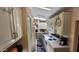Kitchen with white cabinets, appliances, and tile floor at 17200 W Bell Rd # 569, Surprise, AZ 85374