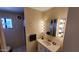Bathroom features a vanity with a large mirror and a shower stall at 17200 W Bell Rd # 569, Surprise, AZ 85374