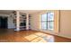 Bright living room with hardwood floors and built-in shelving at 5122 N 31St Way # 227, Phoenix, AZ 85016