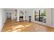 Living room with hardwood floors, open floor plan, and large window at 5122 N 31St Way # 227, Phoenix, AZ 85016
