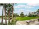 Relaxing patio area with seating overlooking a lake and golf course at 5122 N 31St Way # 227, Phoenix, AZ 85016