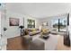 Living room with hardwood floors, neutral decor, and large windows at 5122 N 31St Way # 227, Phoenix, AZ 85016