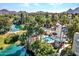 Aerial view showing community pool, lake, and surrounding landscape at 5122 N 31St Way # 227, Phoenix, AZ 85016