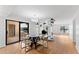 Modern dining area with glass table and chairs, open to living area at 5122 N 31St Way # 227, Phoenix, AZ 85016