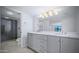 Updated bathroom with gray double vanity and walk-in shower at 5122 N 31St Way # 227, Phoenix, AZ 85016