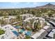Aerial view showing apartment buildings, a pool, and surrounding landscape at 5122 N 31St Way # 227, Phoenix, AZ 85016