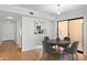 Bright dining area with wood floors and access to patio at 5122 N 31St Way # 227, Phoenix, AZ 85016