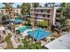 Aerial view of community pool, landscaping, and building exterior at 5122 N 31St Way # 227, Phoenix, AZ 85016