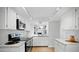 White kitchen with granite counters and modern appliances at 5122 N 31St Way # 227, Phoenix, AZ 85016