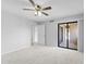 Bedroom with carpet, ceiling fan and sliding glass door to patio at 1932 S Clubhouse Dr, Casa Grande, AZ 85194