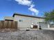 Rear view of house showcasing stucco exterior and garage at 48336 N 27 Ave, New River, AZ 85087