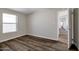 Well-lit bedroom with wood-look floors and a window at 2650 W Union Hills Dr # 38, Phoenix, AZ 85027