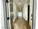 Entryway with wood-look tile flooring leading into the main living area at 22730 E Roundup Way, Queen Creek, AZ 85142