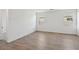 Well-lit bedroom with wood-look floors and neutral walls at 4217 E Brook Lynn Pl, San Tan Valley, AZ 85143