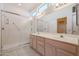 Double vanity bathroom with shower at 14613 W Black Gold Ln, Sun City West, AZ 85375