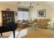 Living room with comfortable seating and a large window at 29922 N Little Leaf Dr, San Tan Valley, AZ 85143