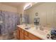 Clean bathroom with double vanity and shower/tub combo at 29922 N Little Leaf Dr, San Tan Valley, AZ 85143