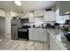 Modern kitchen with gray cabinets, stainless steel appliances, and granite counters at 2941 N 19Th Ave # 84, Phoenix, AZ 85015