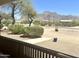 Covered porch with mountain views and a small bistro set at 694 S Mountain View Rd, Apache Junction, AZ 85119