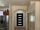 Bright entryway with modern black door and decorative rug at 725 W Hermosa Dr, Wickenburg, AZ 85390