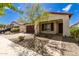 Single-story home with brown garage door and landscaping at 19314 S 208Th Pl, Queen Creek, AZ 85142