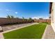 Artificial turf backyard with rock accents at 19314 S 208Th Pl, Queen Creek, AZ 85142