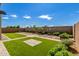 Landscaped backyard with artificial turf and stone pathways at 19314 S 208Th Pl, Queen Creek, AZ 85142