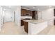 Modern kitchen features a large island, granite countertops, and stainless steel appliances at 19314 S 208Th Pl, Queen Creek, AZ 85142