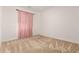 Well-lit bedroom with light pink curtains and carpet at 19314 S 208Th Pl, Queen Creek, AZ 85142