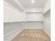Large walk-in closet with ample shelving and hanging space at 19314 S 208Th Pl, Queen Creek, AZ 85142