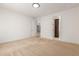 Well-lit bedroom with carpet flooring and access to a hallway bathroom at 19314 S 208Th Pl, Queen Creek, AZ 85142
