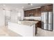 Bright kitchen boasts granite countertops, stainless steel appliances, and an island at 19314 S 208Th Pl, Queen Creek, AZ 85142