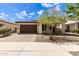 Single-story home with brown garage door and landscaping at 19314 S 208Th Pl, Queen Creek, AZ 85142