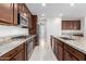 Modern kitchen with stainless steel appliances and granite countertops at 19314 S 208Th Pl, Queen Creek, AZ 85142