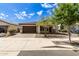 Single-story home with brown garage door and landscaping at 19314 S 208Th Pl, Queen Creek, AZ 85142