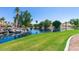 Peaceful lakefront view with lush lawn and waterfall feature at 3327 S Felix Way, Chandler, AZ 85248
