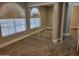 Spacious bedroom featuring arched windows and mirrored closet doors at 427 E Mayfield Dr, San Tan Valley, AZ 85143