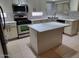 Modern kitchen with island and stainless steel appliances at 427 E Mayfield Dr, San Tan Valley, AZ 85143
