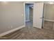 Bedroom with mirrored closet and carpeting at 427 E Mayfield Dr, San Tan Valley, AZ 85143