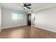 Bedroom with wood-look floors, ceiling fan, and window view at 7625 E Camelback Rd # A418, Scottsdale, AZ 85251