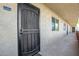 Building exterior with walkway and apartment entrance at 7625 E Camelback Rd # A418, Scottsdale, AZ 85251