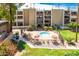 Community pool with surrounding patio and seating at 7625 E Camelback Rd # A418, Scottsdale, AZ 85251