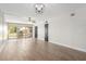 Living room with tile floor, sliding glass doors, and ceiling fan at 7625 E Camelback Rd # A418, Scottsdale, AZ 85251