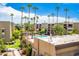 Community pool with palm trees and surrounding buildings at 7625 E Camelback Rd # A418, Scottsdale, AZ 85251