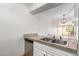 Kitchen features double sink and granite countertops at 7625 E Camelback Rd # A418, Scottsdale, AZ 85251