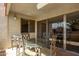 Covered balcony with glass table and chairs at 7625 E Camelback Rd # A418, Scottsdale, AZ 85251