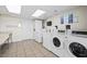 Community laundry room with multiple washers and dryers at 7625 E Camelback Rd # A418, Scottsdale, AZ 85251